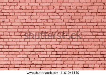 A wall of small red bricks. The texture of the brickwork. Blank background.