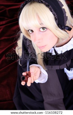 Beautiful cosplay young woman with a pipe