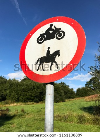 PONTYPRIDD, WALES - AUGUST 2018: Round sign indicating motorbikes and horse riding are not allowed.