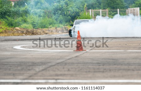 Picture blur Car driver drifting Drag racing car burns rubber