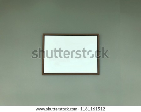 Landscape single rectangle empty area abstract frame with white space and brown wood put on the clean grey wall   using for write some text or display image art printing interior mock up design