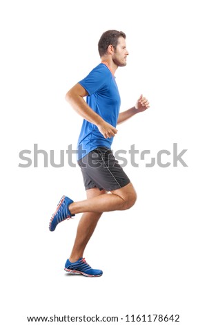 Young attractive athlete running and showing perfect running technique. View from the profile side. Isolated cut out on white background.