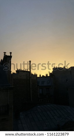 Roofs of Paris at the sunset