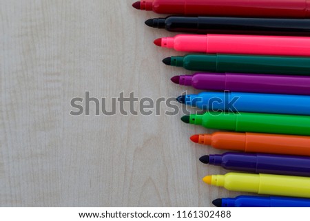 colorful felt-pens on the wooden table for school or kindergarten activity time or education concept.creative ideas for child development.back to school concept.