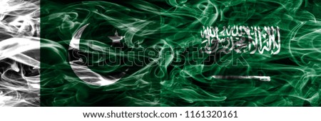 Pakistan vs Saudi Arabia smoke flags placed side by side. Thick colored silky smoke flags of Pakistan and Saudi Arabia