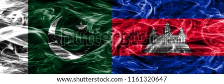 Pakistan vs Cambodia smoke flags placed side by side. Thick colored silky smoke flags of Pakistan and Cambodia