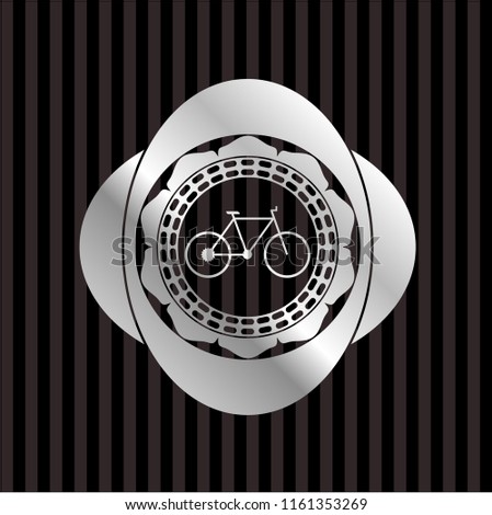 bike icon inside silvery emblem or badge