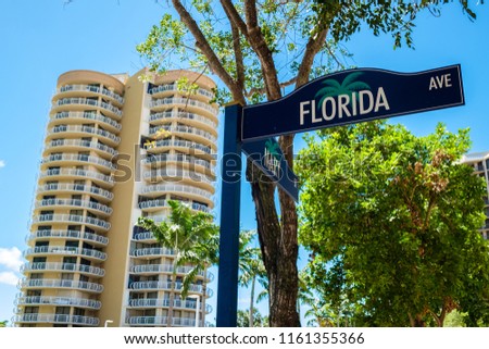 Cityscape sign view of the popular downtown area of Coconut Grove in Miami Dade County.