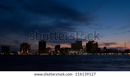 New Orleans, LA city skyline at sunset