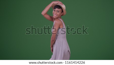 Happy smiling black woman having a good time on green screen