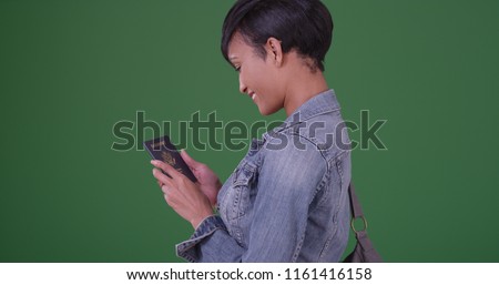 Happy black woman with US Passport on green screen