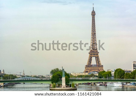 Paris. France. The original version of the Statue of Liberty on the island in front of the Eiffel Tower