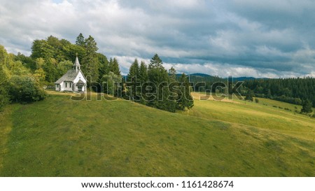 Landscape and the top view of the church in the countryside of Germany