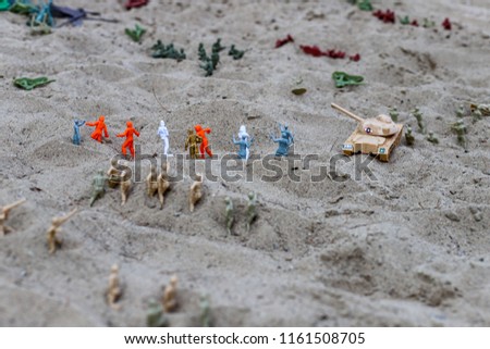Army toys in the sand