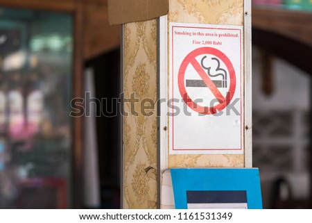 No smokin sign in the market with a blurry background.Thailand