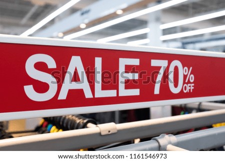 Close up of a SALE 70% off signage in a supermarket