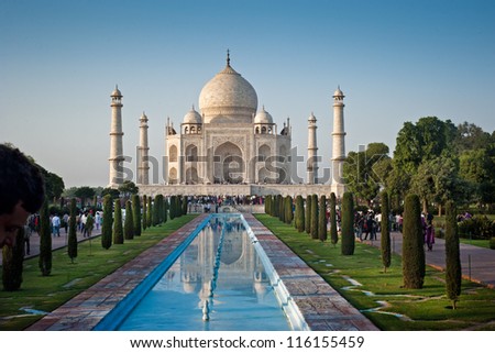  One of the seven wonders of the world - Taj Mahal mausoleum in evening light. Arga, India. Royalty-Free Stock Photo #116155459