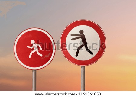 Conflict of parents and children - a man catches a child. Road signs.