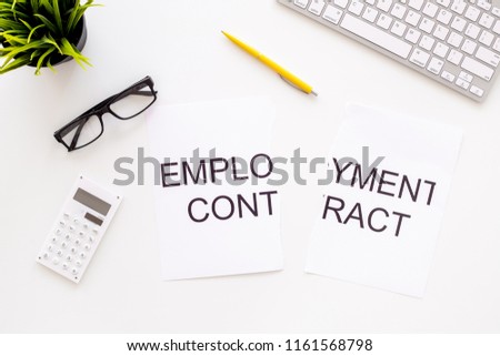 Break the contract concept. Torn sheet of paper with words Employment contract on office desk with computer keyboard on white background top view