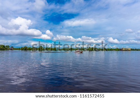 Wonderful view of a boat sailing on the Amazon river near to Iquitos in Peru.