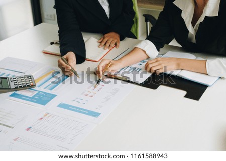 Businesswoman hand pointing pen on business document at meeting discussion and analysis data the charts and graphs showing the results at meeting.Business financial and accounting concept. Royalty-Free Stock Photo #1161588943