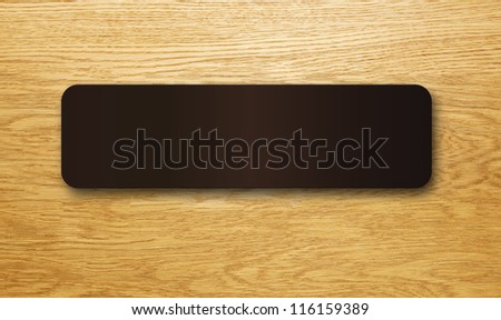 Blank sign on a wooden office door.