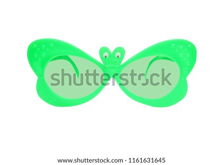 Green plastic sunglasses in butterfly shape isolated on white background