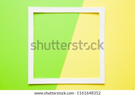 White frame on pastel green and yellow paper background. Bright, acid colors. Greeting card. Mockup for positive idea. Empty place for inspirational, motivation text, quote or sayings.