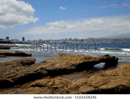 Coast landscape, blue sky and clouds, El Confital and Las Palmas city, Canary Islands