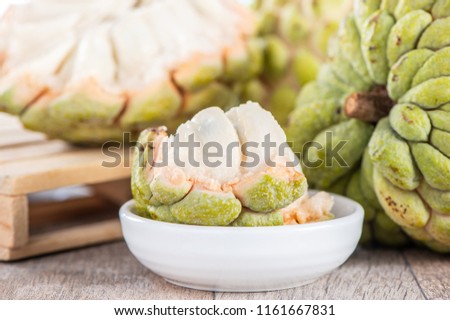 fresh sugar apple fruit(Custard Apple),sweetsop on wooden table background