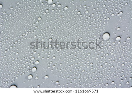 Close up of water drops on gray tone background. Abstarct black wet texture with bubbles on window glass surface or grunge. Raindrop, Realistic pure water droplets condensed for creative banner design