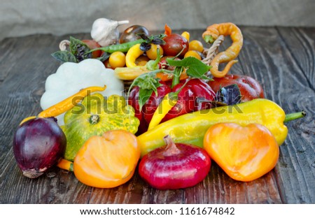 Basket of vegetables on the old wooden tabble