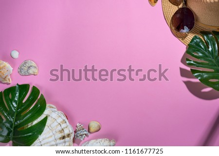 seashells on pastel violet background with straw hat - summer holiday background. Panton color of 2018 year