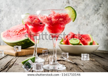 Sweet summer watermelon and lime granita with sliced watermelon and mint, on white marble background copy space