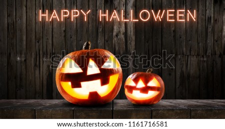 Halloween pumpkins on dark wooden background