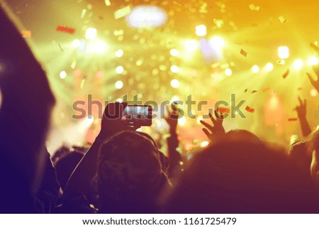 silhouettes of  , Fun concert party rock disco light background.