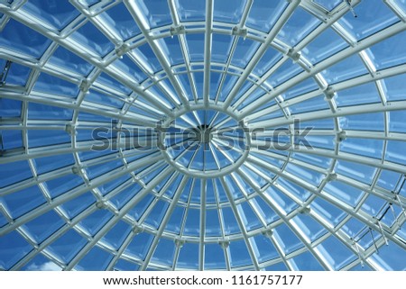 glass roof of the ceiling is made of transparent windows. A modern ecological structure for saving energy. blue sky