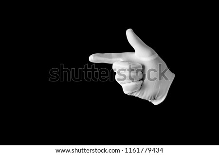 Hand in a white glove on a black background. Pointer showing direction. Gesticulation.