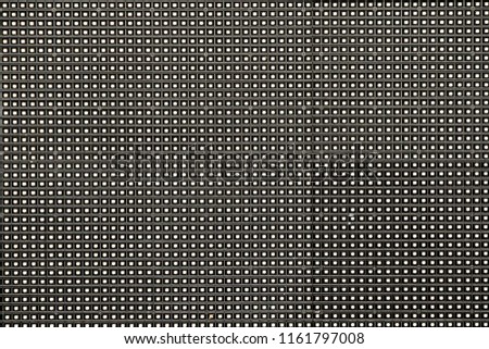 The dark gray plastic vinyl sheet with the little holes texture background. 