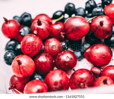 Gooseberries and blueberries Royalty-Free Stock Photo #1161827551