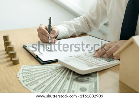 A company employee is signing a house contract. For security purposes, securities are required.