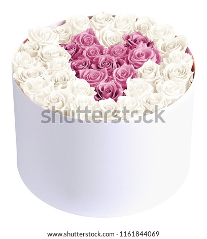 Arrangement of pink and white roses flowers in a heart shape in the round plain vase of flowers. Best option to spread love in the home area.
