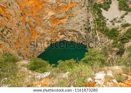 Red Lake is a sinkhole containing a karst lake near the city of Imotski, Croatia.