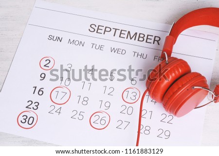 Calendar with headphones. Musical september calendar. Music and Organization management concept.