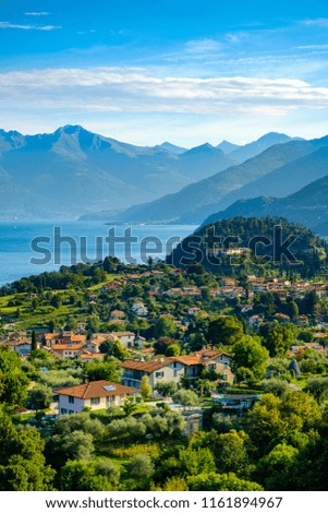 Sunny summers day overlooking Lake Como and the village of Bellagio from the surrounding hills and mountains. Royalty-Free Stock Photo #1161894967
