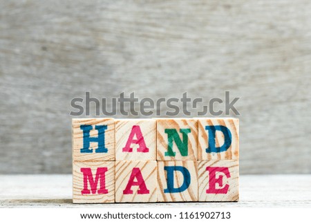 Letter block in word handmade on wood background