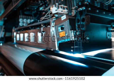 Elements from the production chain within a massive printing facility, newspaper, magazine, billboards, and any commercial print is made here.  Royalty-Free Stock Photo #1161925102