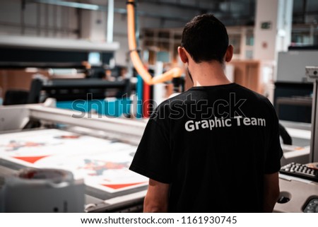 Printing facility. Working class heroes providing customers top quality editorial and commercial products. Worldwide shipping.  Royalty-Free Stock Photo #1161930745
