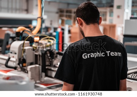 Printing facility. Working class heroes providing customers top quality editorial and commercial products. Worldwide shipping.  Royalty-Free Stock Photo #1161930748