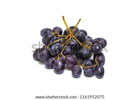 a bunch of dark grapes isolated on white background